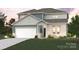Charming two-story home with blue and gray siding, white trim, and an attached two-car garage at 9944 Manor Vista Trl, Kannapolis, NC 28027