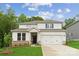 Charming two-story home with a well-manicured lawn, inviting entrance, and a two-car garage at 9956 Manor Vista Trl, Kannapolis, NC 28027