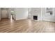 Bright living room featuring wood-look floors, fireplace, and windows with natural light and recessed lighting at 9956 Manor Vista Trl, Kannapolis, NC 28027