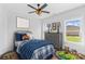 The cozy bedroom is decorated with modern furniture, toys, and a ceiling fan at Lot 101 Coppergate Dr, Salisbury, NC 28147