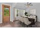 Elegant dining room showcasing a well-lit space, a beautifully set table, and large windows at Lot 101 Coppergate Dr, Salisbury, NC 28147