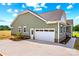 The home features an attached two-car garage and a manicured lawn at Lot 101 Coppergate Dr, Salisbury, NC 28147