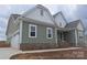 New home features neutral siding, white trim, attached two car garage, and covered entry at Lot 101 Coppergate Dr, Salisbury, NC 28147