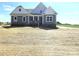 Craftsman-style home featuring mixed siding, covered porch, and a spacious yard at Lot 101 Coppergate Dr, Salisbury, NC 28147