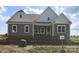 Charming craftsman style home with mixed siding and brick accents and covered entryway at Lot 101 Coppergate Dr, Salisbury, NC 28147