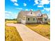 New construction home featuring a long driveway, manicured lawn, and attached garage at Lot 101 Coppergate Dr, Salisbury, NC 28147