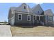 New construction home with covered porch, attached garage, and a fresh, modern design at Lot 101 Coppergate Dr, Salisbury, NC 28147