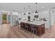 Spacious open kitchen featuring a large island, stainless steel appliances, and modern pendant lighting at Lot 101 Coppergate Dr, Salisbury, NC 28147