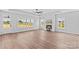 Bright and airy living room with hardwood floors, a fireplace, large windows, and natural light at Lot 101 Coppergate Dr, Salisbury, NC 28147