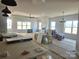 Bright and airy living room with tray ceilings, a ceiling fan, and multiple windows at Lot 101 Coppergate Dr, Salisbury, NC 28147