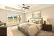Serene main bedroom featuring soft lighting, a comfortable bed, and a large window with outdoor views at Lot 101 Coppergate Dr, Salisbury, NC 28147