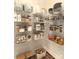 Organized walk-in pantry with wire shelving stocked with food items and containers at Lot 101 Coppergate Dr, Salisbury, NC 28147