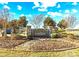 Entrance sign for Yorkshire Farms featuring stone pillars, landscaping, and a clear blue sky at Lot 101 Coppergate Dr, Salisbury, NC 28147