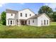 Back of house with porch, outdoor furniture, large yard and mature trees at 100 Brookstone Dr, Mount Holly, NC 28120