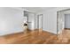 Spacious bedroom with hardwood floors and neutral paint offers a bright and airy atmosphere at 100 Brookstone Dr, Mount Holly, NC 28120