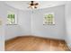 Sunlit bedroom with hardwood floors and bright windows offering a welcoming space at 100 Brookstone Dr, Mount Holly, NC 28120