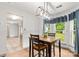 Cozy eating space highlighting wood flooring, modern lighting, and plant at 100 Brookstone Dr, Mount Holly, NC 28120