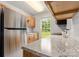 Updated kitchen featuring stainless steel appliances, light wood cabinets, and granite countertops at 100 Brookstone Dr, Mount Holly, NC 28120