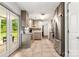 Bright kitchen with stainless steel appliances, tiled backsplash, and access to a patio with outdoor seating through glass doors at 100 Brookstone Dr, Mount Holly, NC 28120