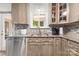 Kitchen area displays granite counters, stainless appliances, and a sunlit window offering a pleasant cooking environment at 100 Brookstone Dr, Mount Holly, NC 28120