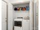 Laundry room with side by side washer and dryer, and shelving for storage at 100 Brookstone Dr, Mount Holly, NC 28120