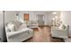 Bright living room featuring wood flooring, neutral walls, and a comfortable sectional at 100 Brookstone Dr, Mount Holly, NC 28120