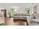 Bright living room featuring wood flooring, a cabinet and plenty of natural light at 100 Brookstone Dr, Mount Holly, NC 28120