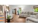 Bright living room featuring wood flooring, a fireplace, staircase and plenty of natural light at 100 Brookstone Dr, Mount Holly, NC 28120