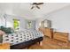 Spacious main bedroom with wood floors, vaulted ceiling, and sun-filled windows at 100 Brookstone Dr, Mount Holly, NC 28120
