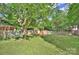 Lush backyard with play-set and hammock, great for outdoor activities at 10016 Tealridge Ln, Charlotte, NC 28277