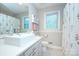 Bathroom featuring a modern vanity, stylish fixtures, and floral accents, adding a touch of elegance at 10016 Tealridge Ln, Charlotte, NC 28277