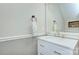 Clean and bright bathroom with a modern vanity and mirror at 10016 Tealridge Ln, Charlotte, NC 28277