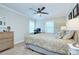Bedroom featuring a bed, dresser, ceiling fan, and a computer desk, creating a functional space at 10016 Tealridge Ln, Charlotte, NC 28277