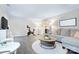 Inviting living room with hardwood floors and a comfortable couch at 10016 Tealridge Ln, Charlotte, NC 28277