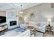 Cozy living room featuring a brick fireplace, comfortable seating, and stylish decor accents at 10016 Tealridge Ln, Charlotte, NC 28277