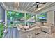 Cozy screened-in porch with comfortable seating and ceiling fan at 10016 Tealridge Ln, Charlotte, NC 28277