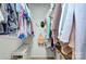 Organized walk-in closet featuring shelving and hanging space, providing ample storage at 10016 Tealridge Ln, Charlotte, NC 28277
