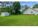 Large, fenced backyard includes a shed and well-maintained lawn, ideal for outdoor activities at 104 Gallarie Pl, Salisbury, NC 28144