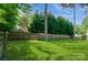 Large backyard featuring a well-maintained lawn and a classic wooden fence at 104 Gallarie Pl, Salisbury, NC 28144
