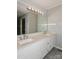 Bright bathroom with a double sink vanity, large mirror, and neutral countertops at 104 Gallarie Pl, Salisbury, NC 28144