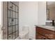 This gorgeous bathroom features a glass shower, modern sink, and bright white walls at 104 Gallarie Pl, Salisbury, NC 28144