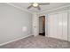 This lovely bedroom boasts an open door, closet, neutral walls and carpet flooring at 104 Gallarie Pl, Salisbury, NC 28144