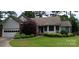 Charming single-story home featuring well-maintained landscaping and attached two-car garage at 104 Gallarie Pl, Salisbury, NC 28144