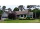Charming single-story home featuring well-maintained landscaping and attached two-car garage at 104 Gallarie Pl, Salisbury, NC 28144