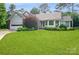 Charming single Gathering home with a well manicured front yard and mature trees at 104 Gallarie Pl, Salisbury, NC 28144