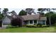 Charming single-story home featuring well-maintained landscaping and attached two-car garage at 104 Gallarie Pl, Salisbury, NC 28144