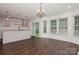 Spacious kitchen area with granite countertops, custom cabinets, and natural lighting at 104 Gallarie Pl, Salisbury, NC 28144
