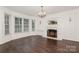 Bright living room with a fireplace and three large windows at 104 Gallarie Pl, Salisbury, NC 28144