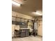 Unfinished basement area with storage shelves, utility sink, and hot water heater at 10817 Bere Island Dr, Charlotte, NC 28278