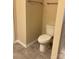 Powder room includes neutral walls, toilet, and tile flooring at 10817 Bere Island Dr, Charlotte, NC 28278